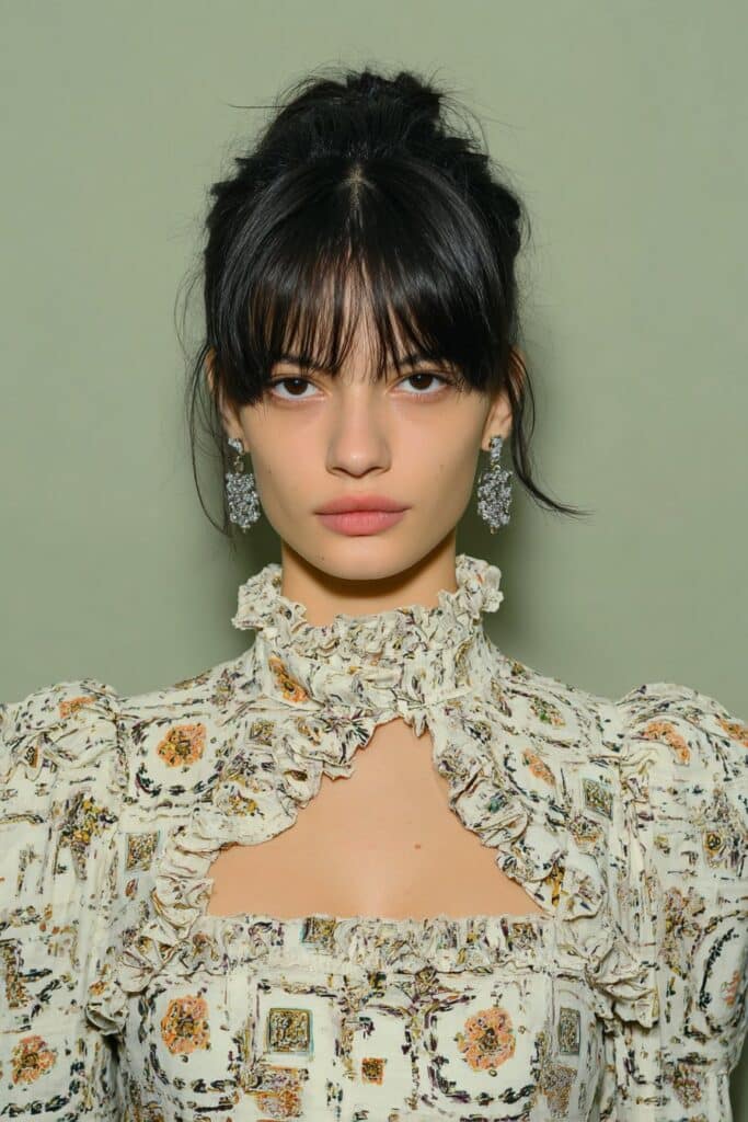 Brunette girl with angled long bob.