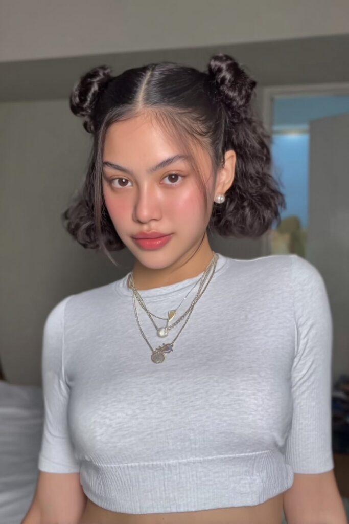 17 Stunning Half Up Half Down Pigtails to Try Today 4 A person with bubble half up half down pigtails hairstyle