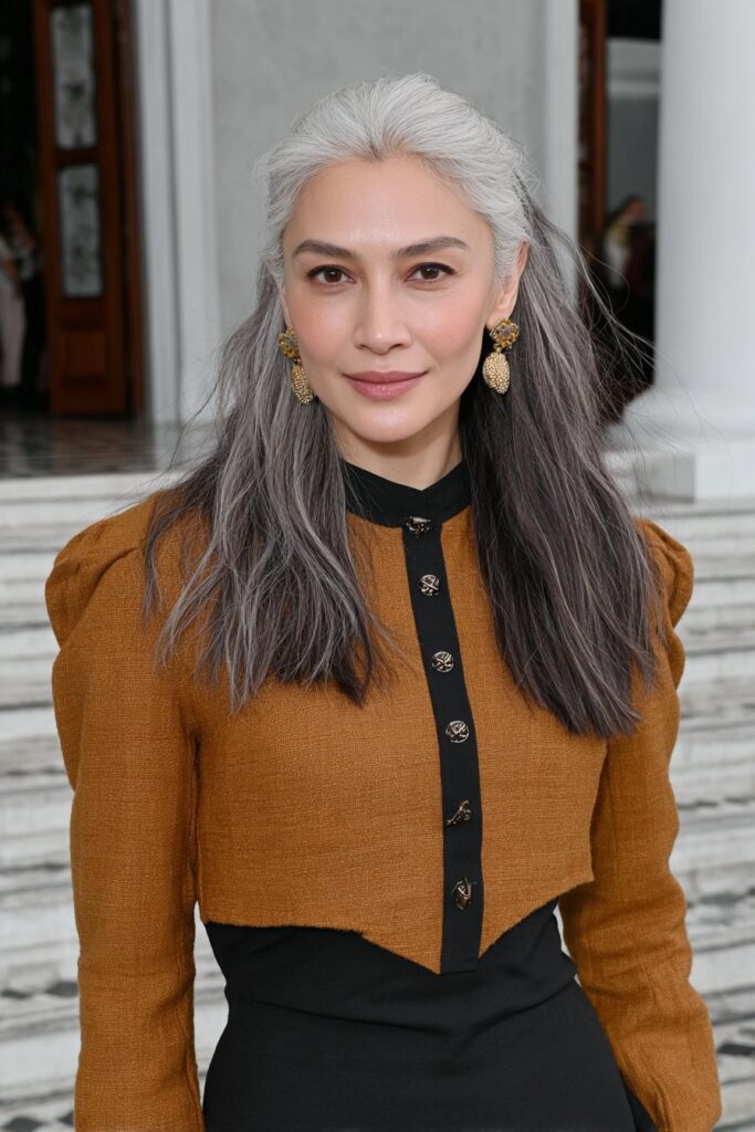 Caramel balayage medium shag for woman over 50 with layered texture and warm highlights.