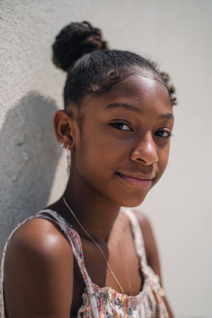 Young black woman with classic slick back bun hairstyle