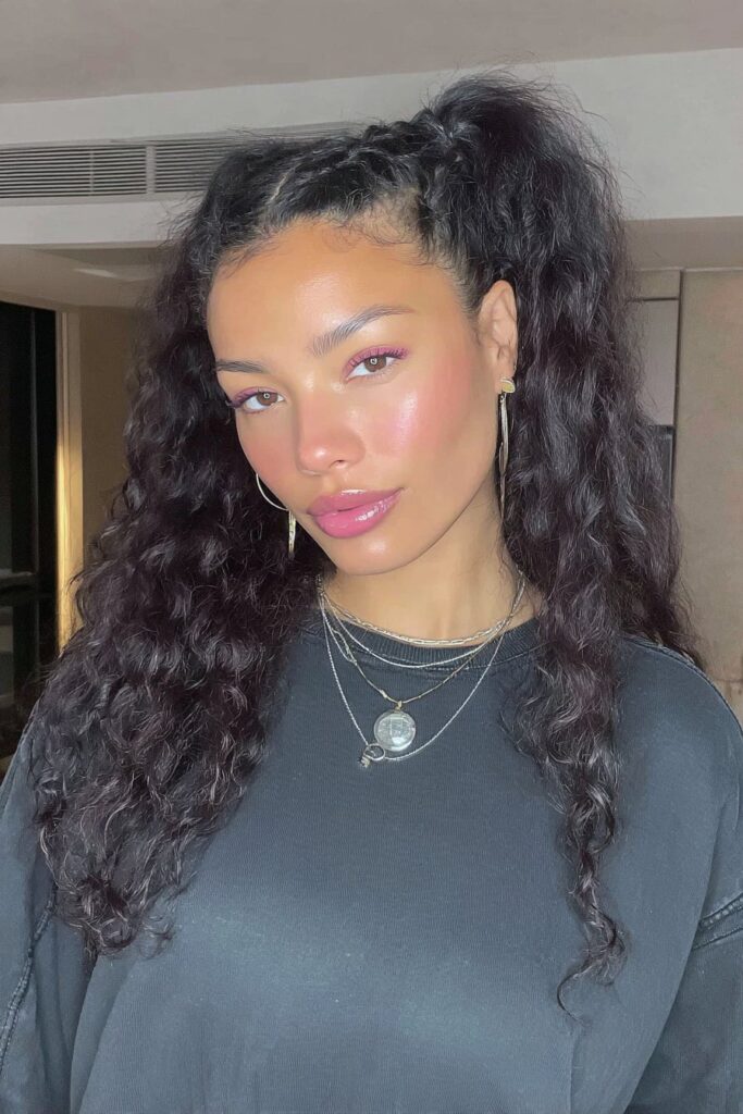 17 Stunning Half Up Half Down Pigtails to Try Today 7 A person with curly half up half down pigtails hairstyle