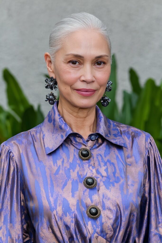 Feathered pixie cut on silver hair adding lightness and volume.