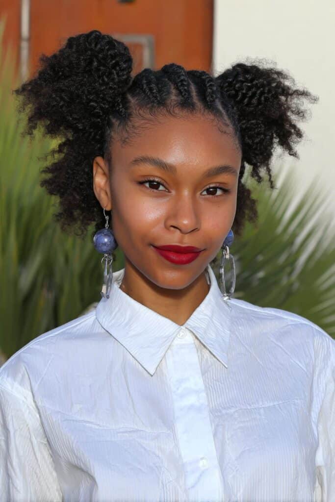 Girl with flat twists braided along the scalp