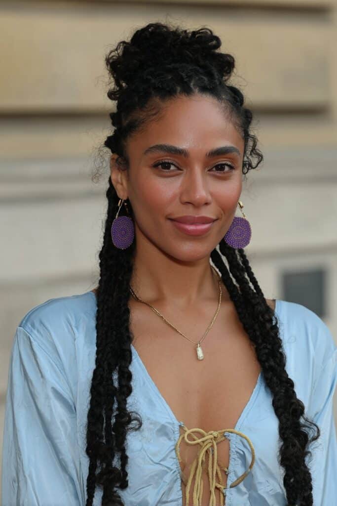 French Curl Braids with Color Highlights on a woman with mixed colorful curly braid ends