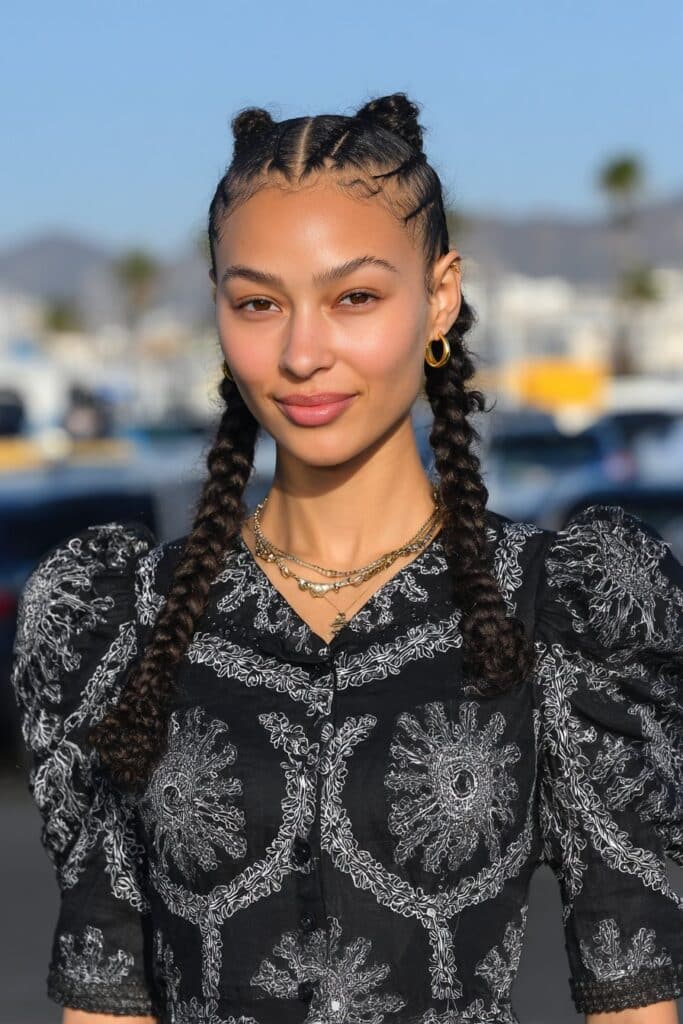 Half-Up Half-Down French Curl Braids on a girl with flowing curled braid ends