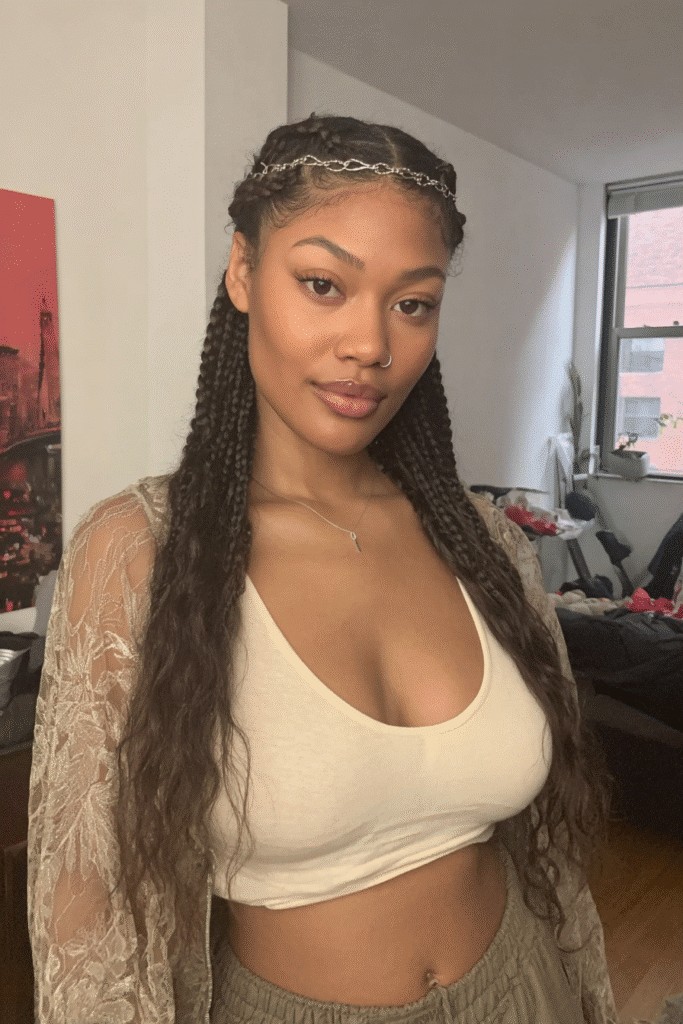 17 Stunning Half Up Half Down Quick Weave Hairstyles 10 A girl with a creative half up half down quick weave featuring a braided crown accent.