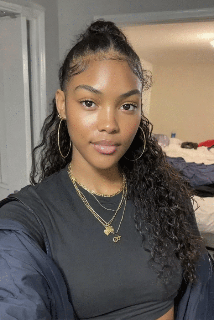 17 Stunning Half Up Half Down Quick Weave Hairstyles 14 A girl with a half up half down quick weave featuring playful flipped ends.