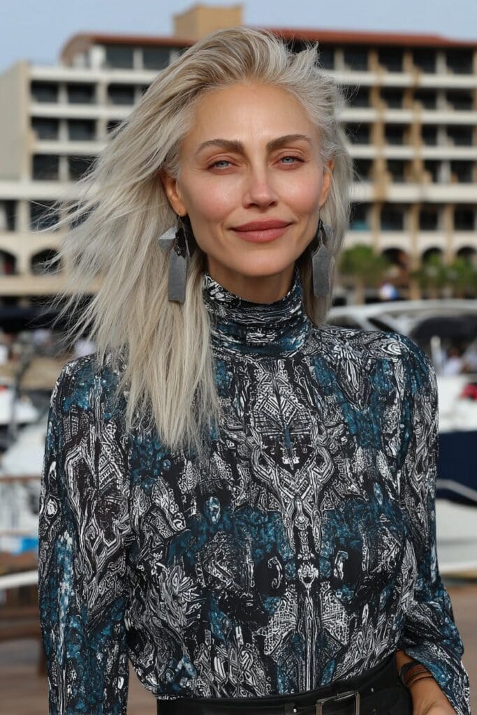 Elegant ivory white long shag for woman over 50 with tapered layers and natural flow.