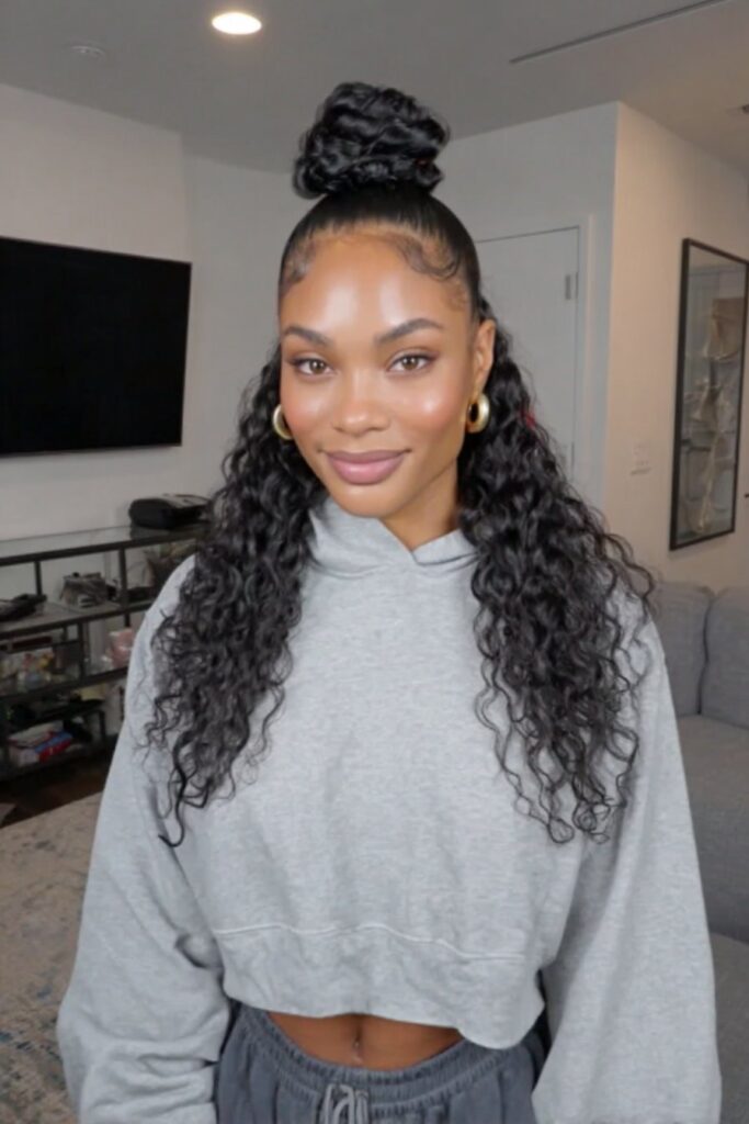 17 Stunning Half Up Half Down Quick Weave Hairstyles 15 A woman wearing a half up half down quick weave styled with neat twists.