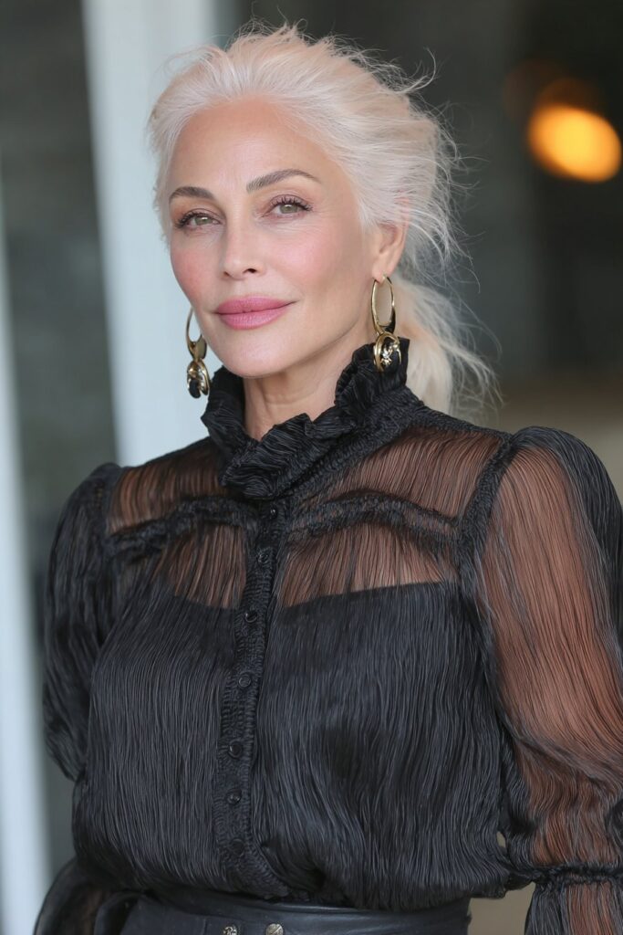 Platinum blonde wispy pixie cut with airy texture and bright, radiant color.