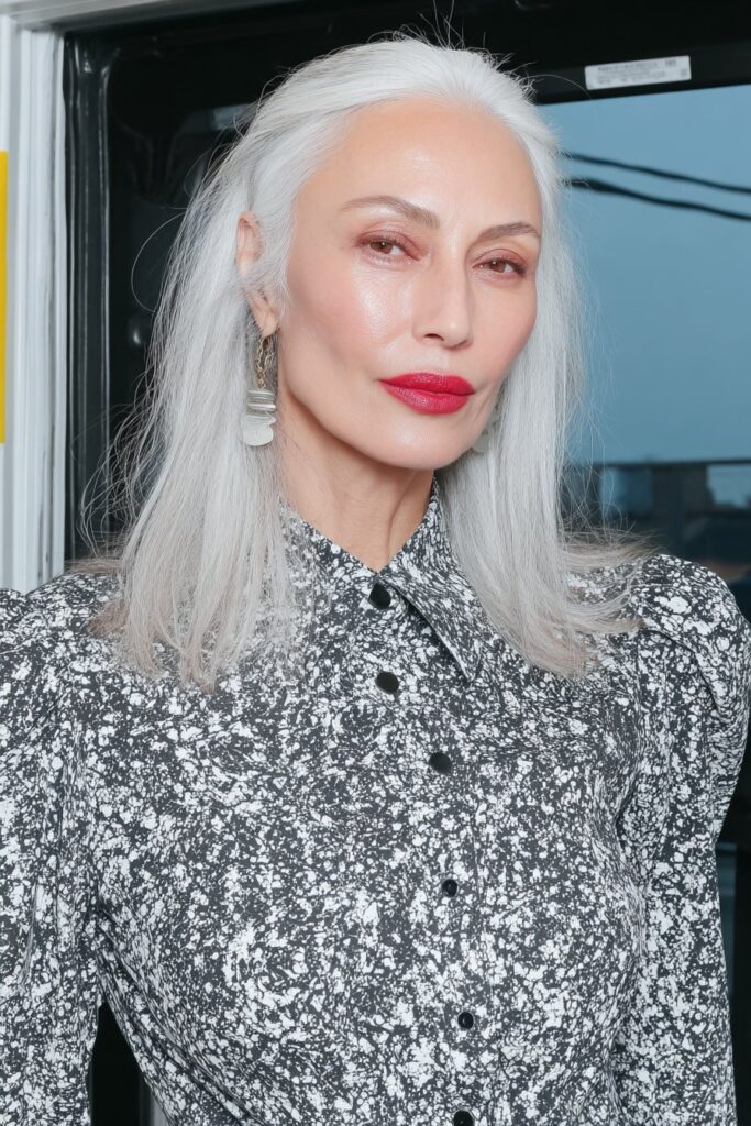 Rose gold shag with waves for woman over 50 adding soft metallic tones and texture.