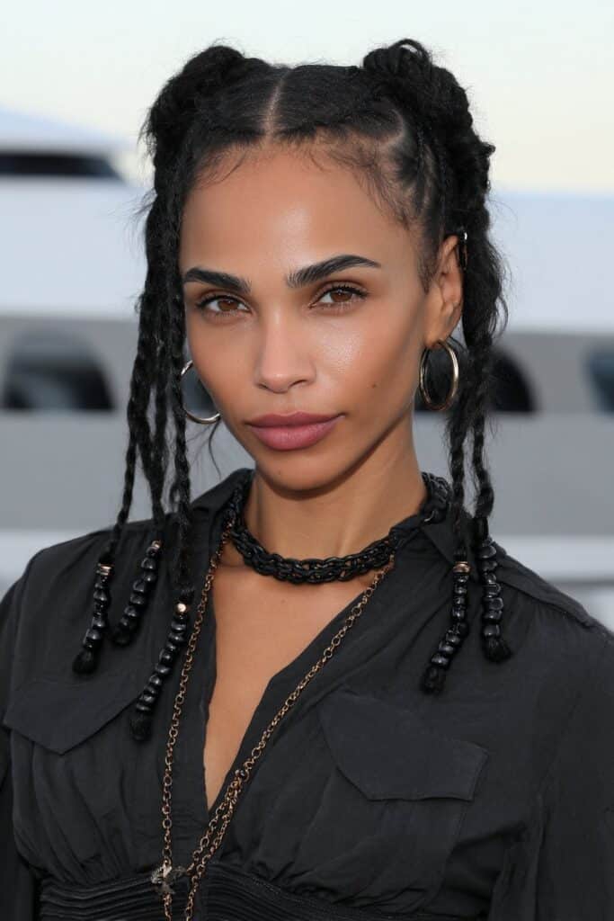woman with short bob braids with beads