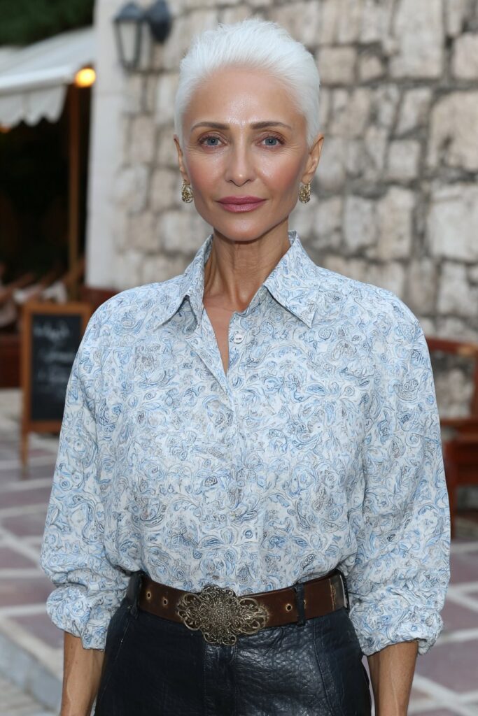 Short feathered pixie cut with side-swept bangs for soft face framing.