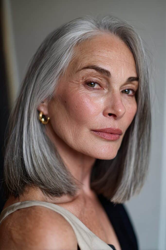 Blunt lob haircut for straight hair with sharp, clean edges.