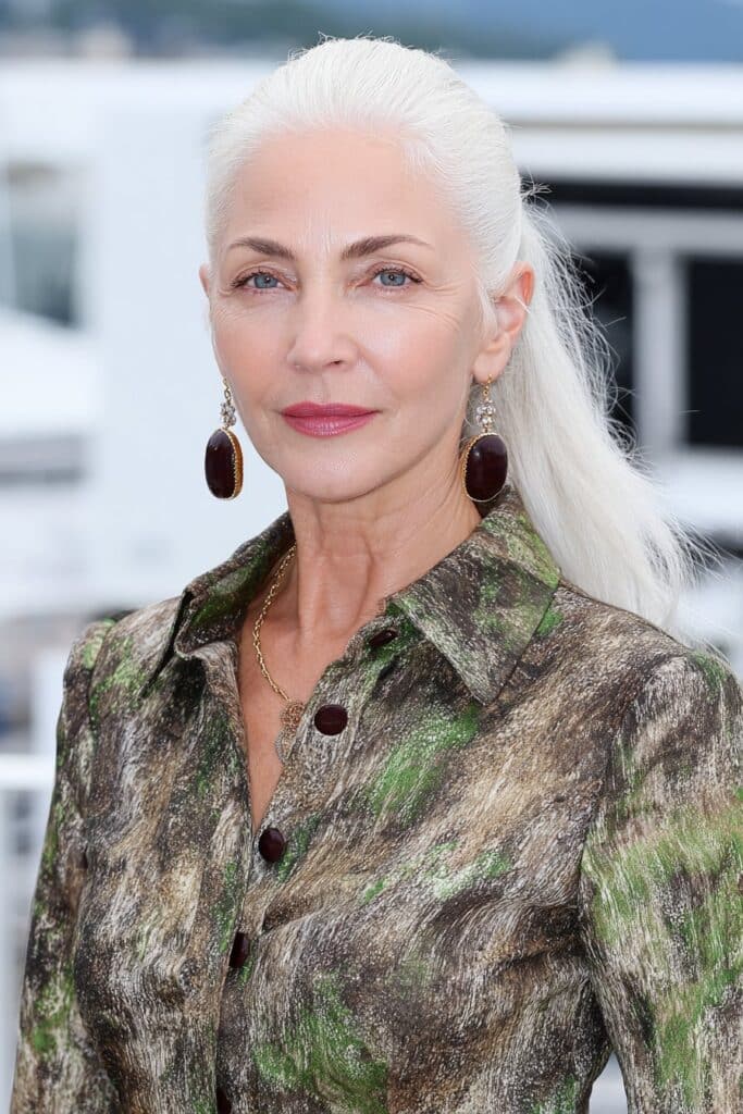 60-year-old woman with a natural-finish butterfly haircut for effortless, low-maintenance beauty.