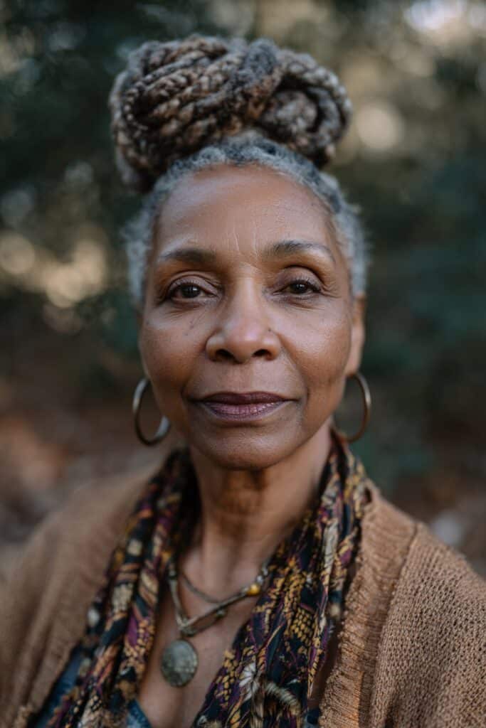 Cornrows pulled into a bun and decorated with accessories such as cuffs or pins.