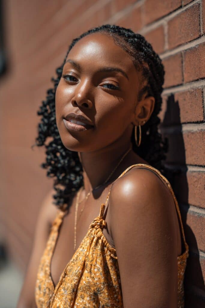 Pre-curled or braided extensions looped through cornrows for a versatile, lightweight style.