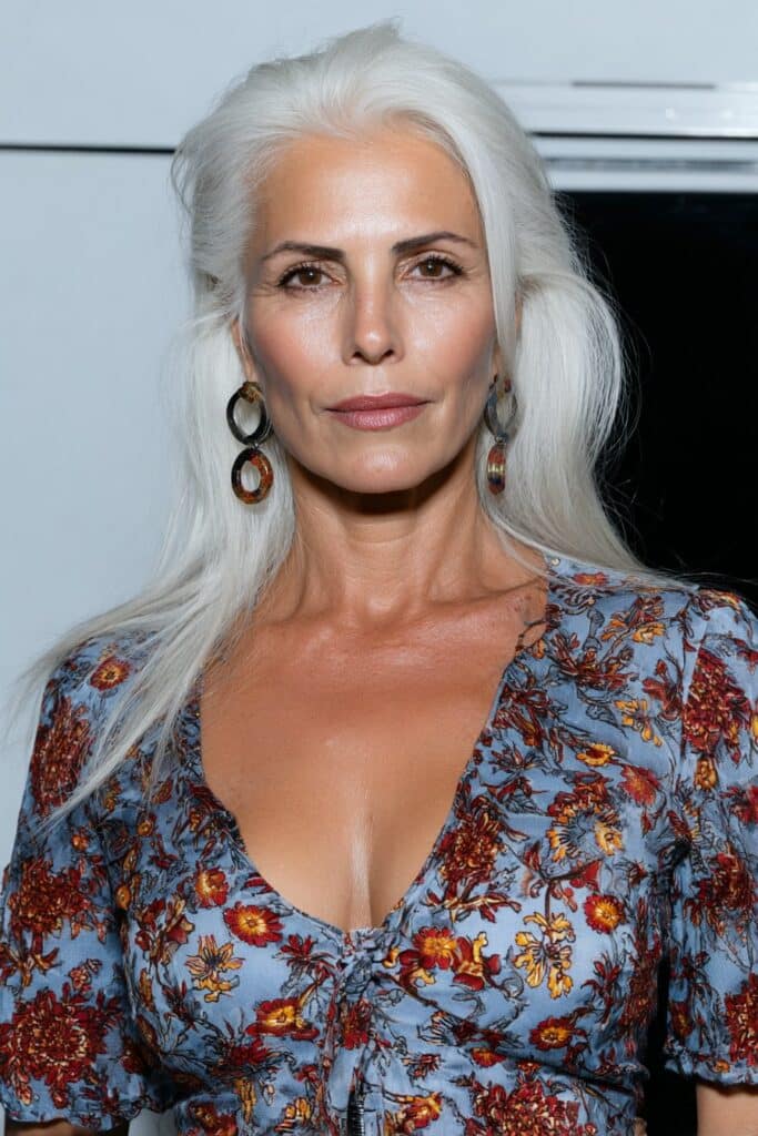 60-year-old woman with fine hair styled in a layered butterfly cut for added volume and movement.