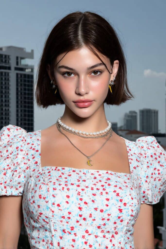 A girl with medium razor-cut butterfly layers