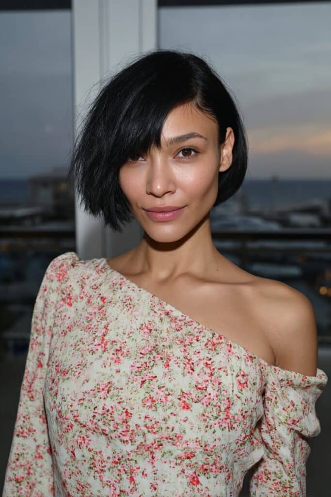 Girl with shaggy medium haircut and soft curtain bangs