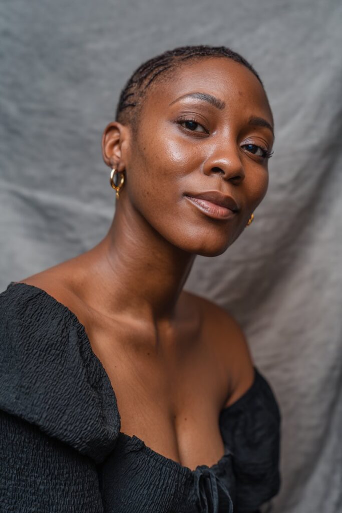 Short braids on top paired with shaved or closely cut sides for a bold contrast.