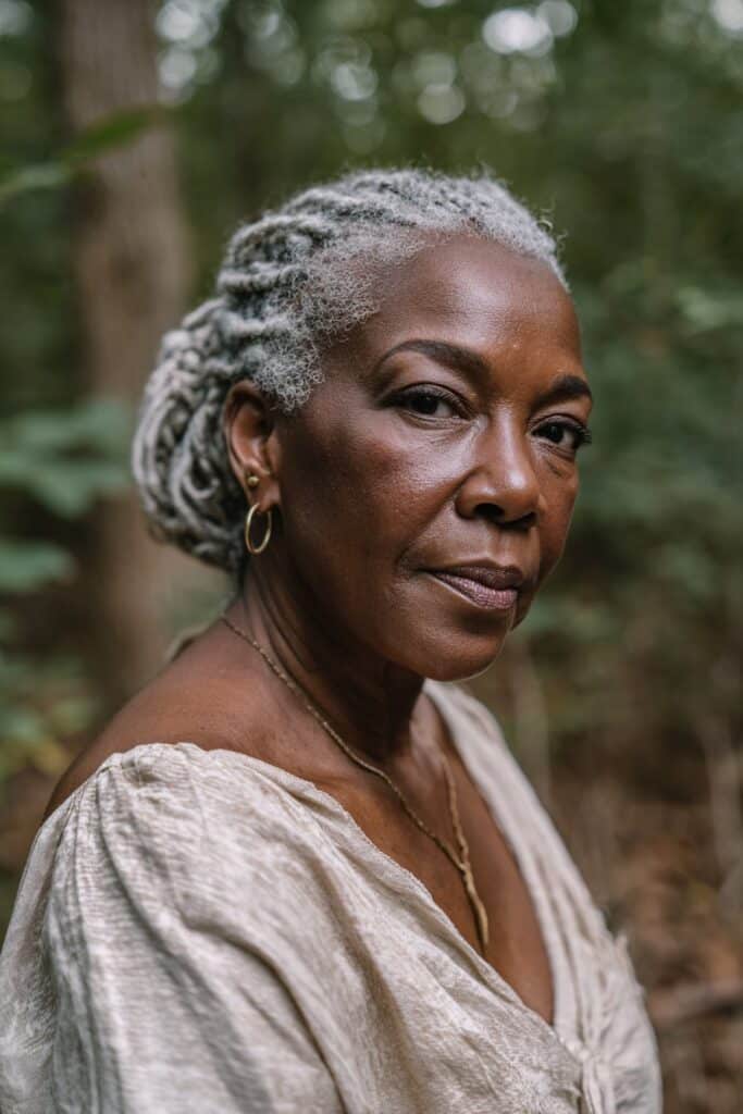 Chin-length bob of cornrows in silver tones, with clean ends and structured shaping.