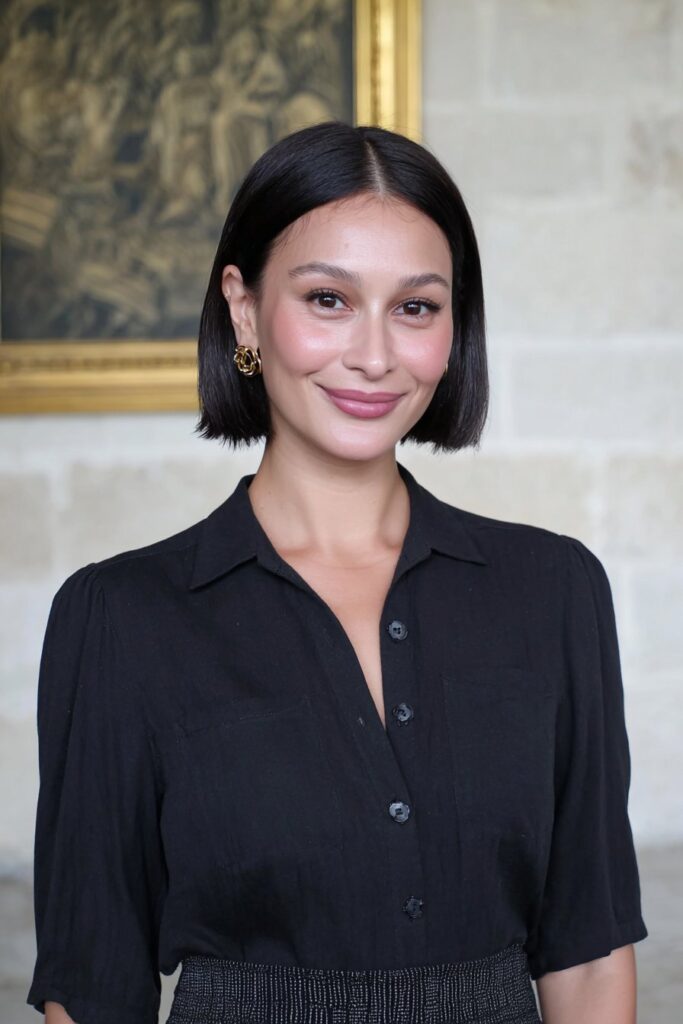 A fun, textured spiky bun hairstyle that adds edge and personality to a school outfit.