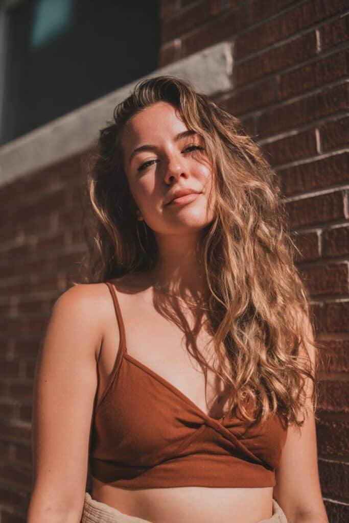 Mocha brown hair subtly brightened with sunlit, golden-brown reflections.