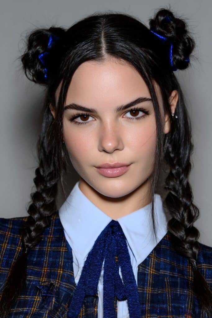 School girl with natural curls styled into a low puff pop hairstyle, looking neat and confident for class.