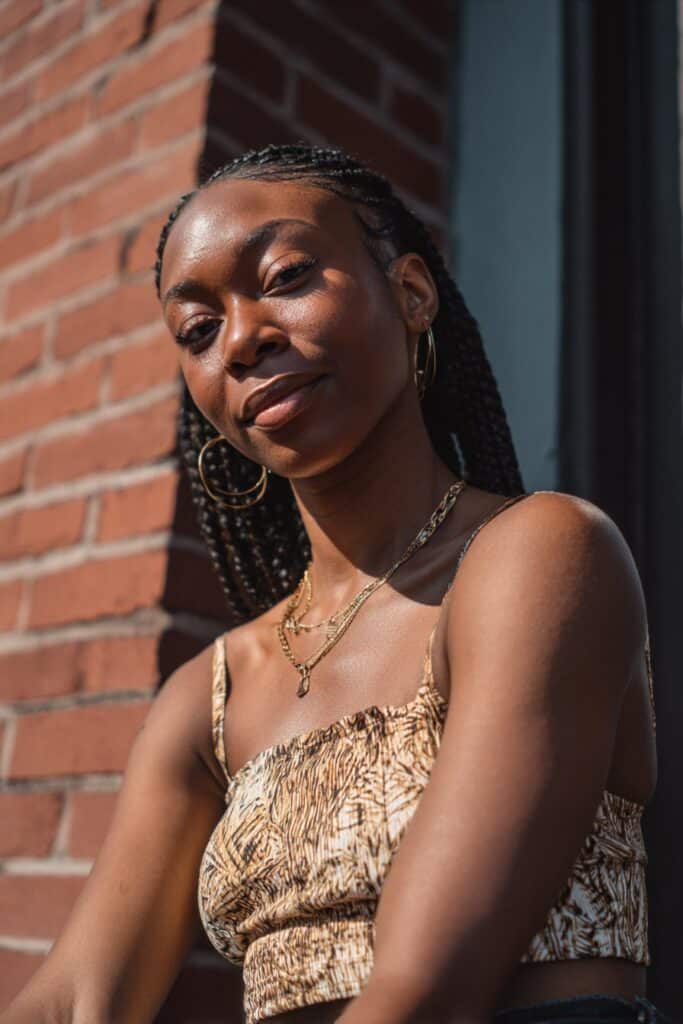 Box braids created using triangular sections for a geometric, modern pattern.