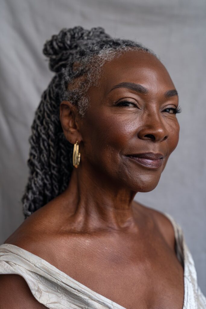 Cornrows gathered into a ponytail and twisted together for a sleek, unified finish.