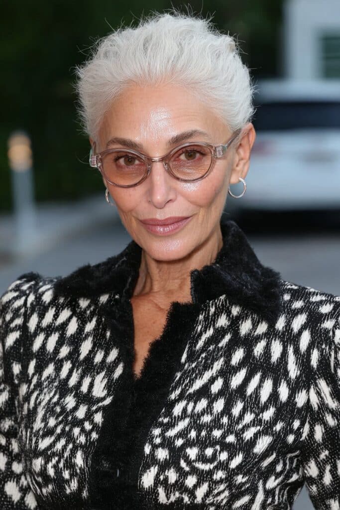 Woman over 60 with a very short tapered pixie, closely cropped for a clean and easy-to-maintain look.