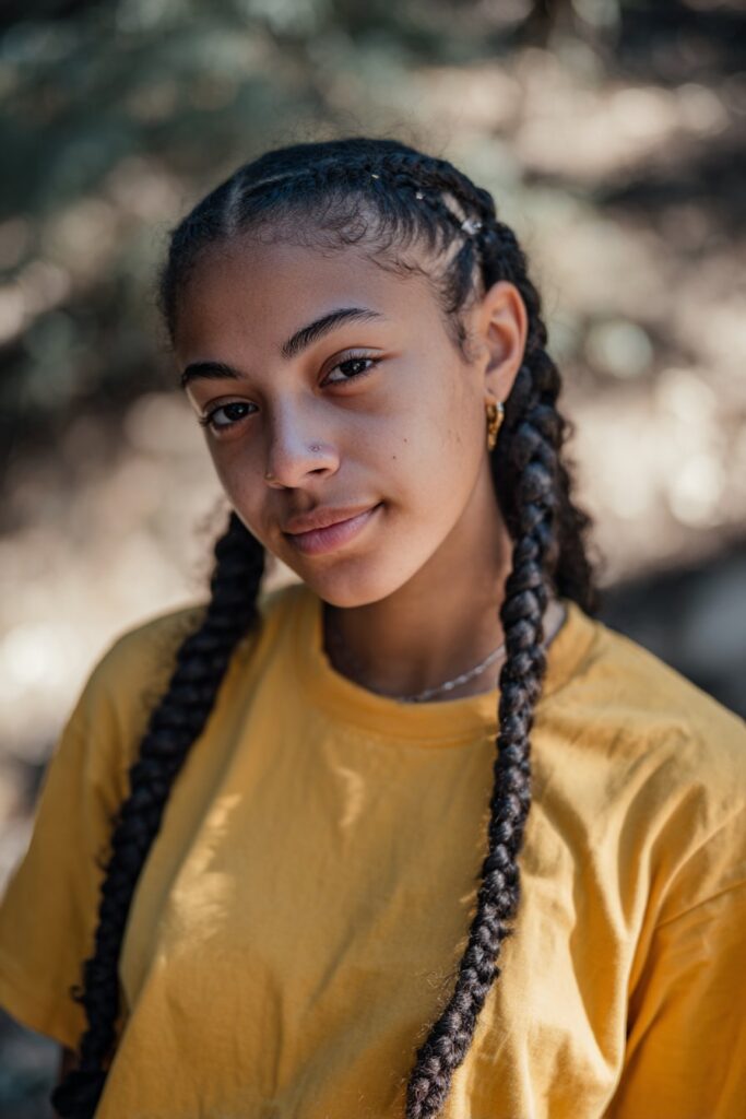 Front cornrows paired with large, chunky jumbo box braids for a statement style.