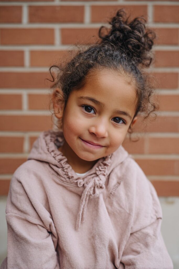 Half-up curly top knot