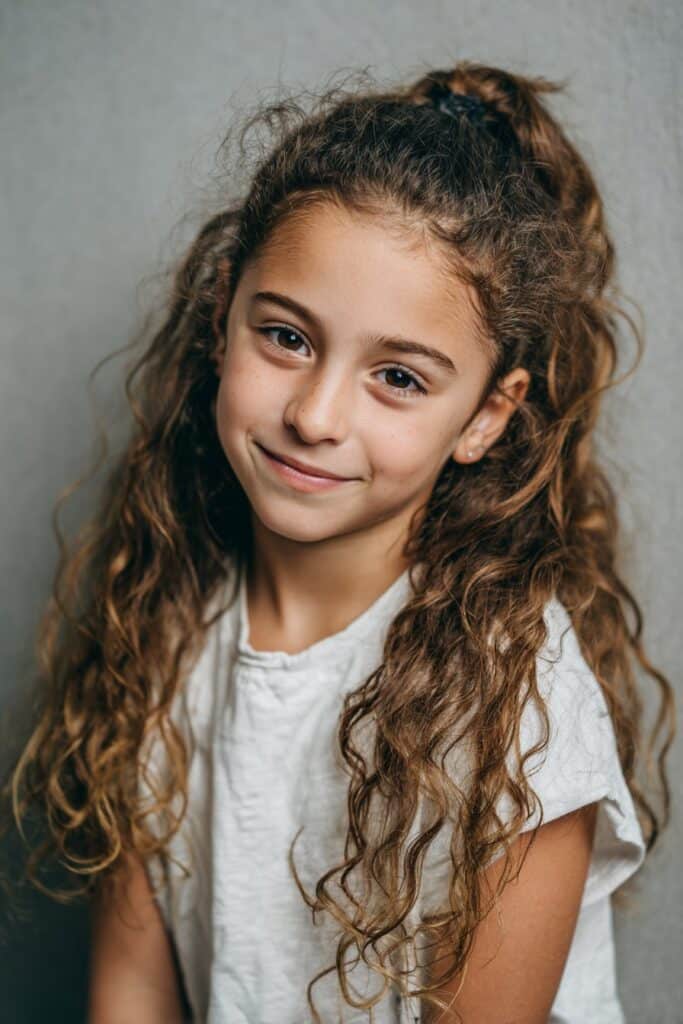 Low curly puff ponytail