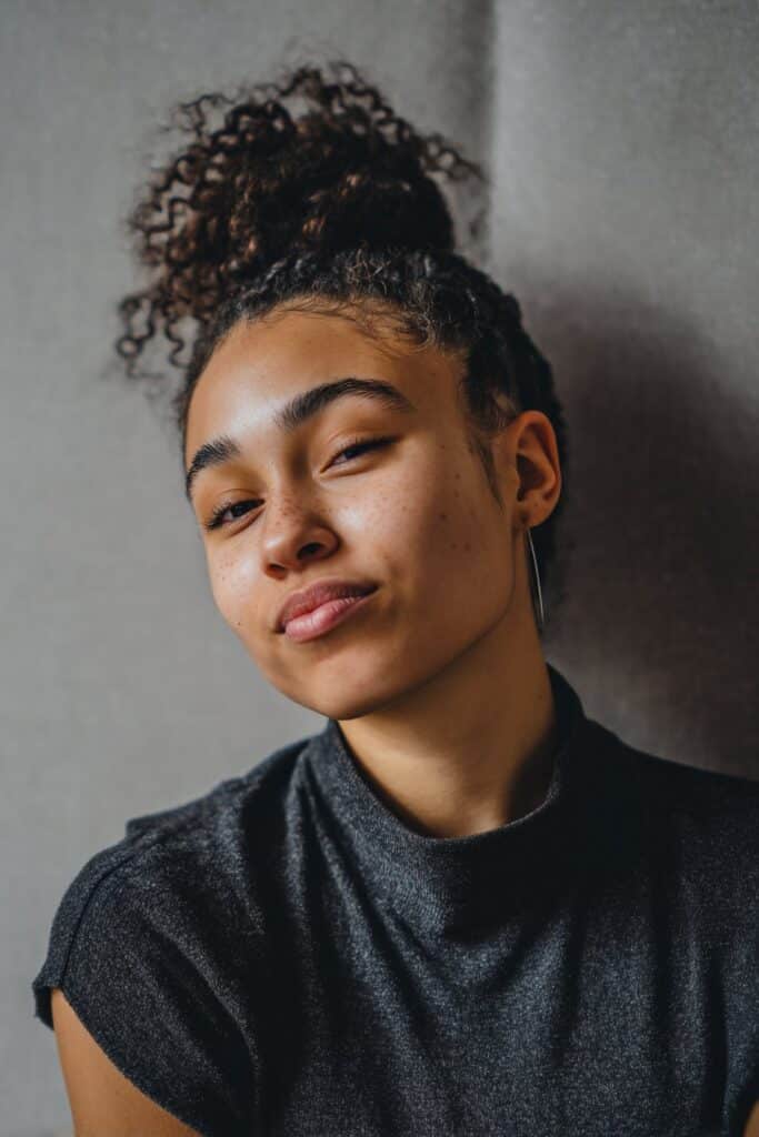 Hair is fed into the outer strands, creating fuller braids while keeping the base lightweight.