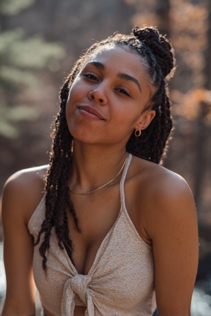 Extensions are added as two strands are twisted together, creating sleek, rope-like twists.