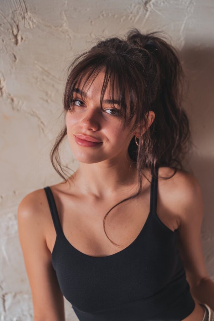 Practical, tousled ponytail with bangs kept in place for active or sporty styling.