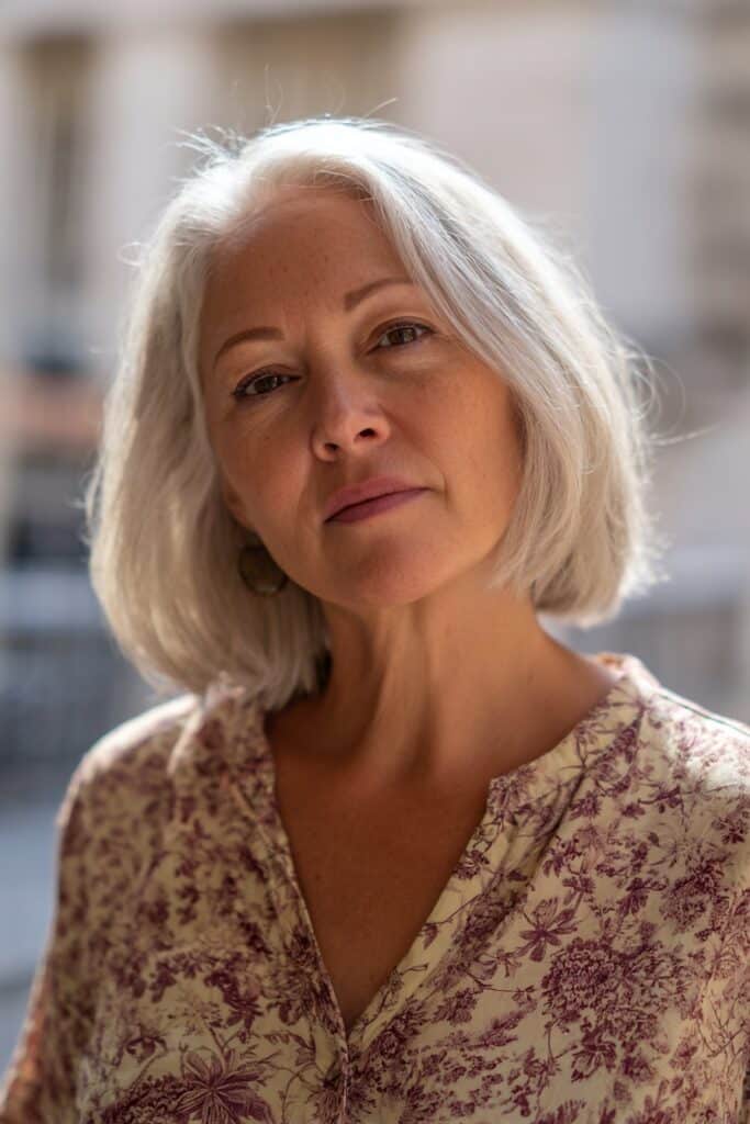 Chin-length bob with natural texture for women over 60, wash and wear cut