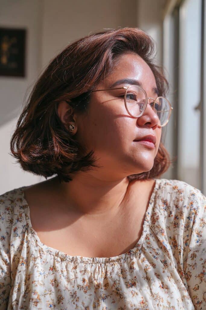 Chin-length bob hairstyle with soft waves for women.