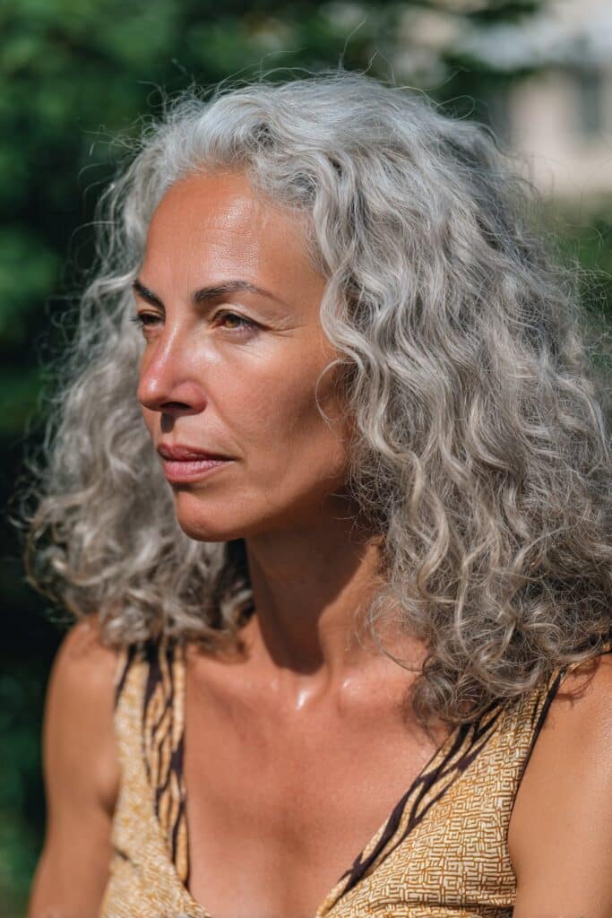 Curly gray lob hairstyle for women over 50