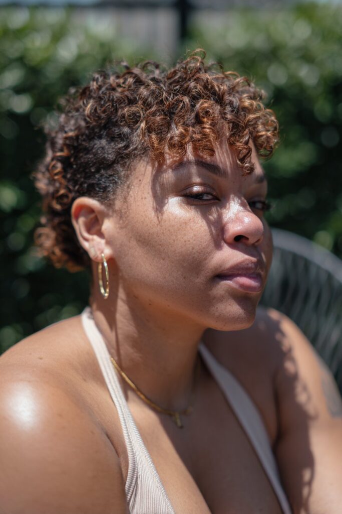 Curly pixie haircut adding volume for fat face and thin hair