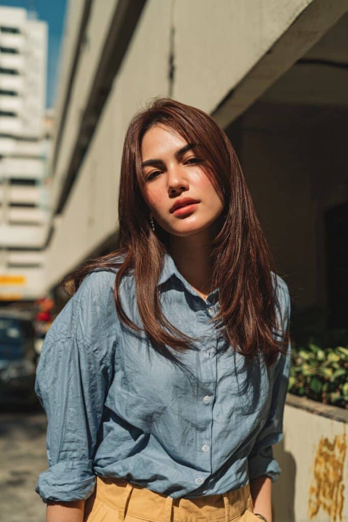 Straight hair with side curtain bangs and face-framing layers