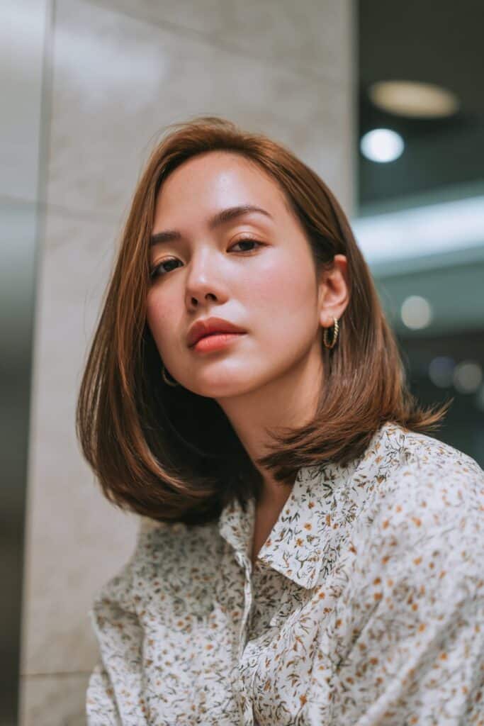 Straight hair with side-part curtain bangs and glossy finish