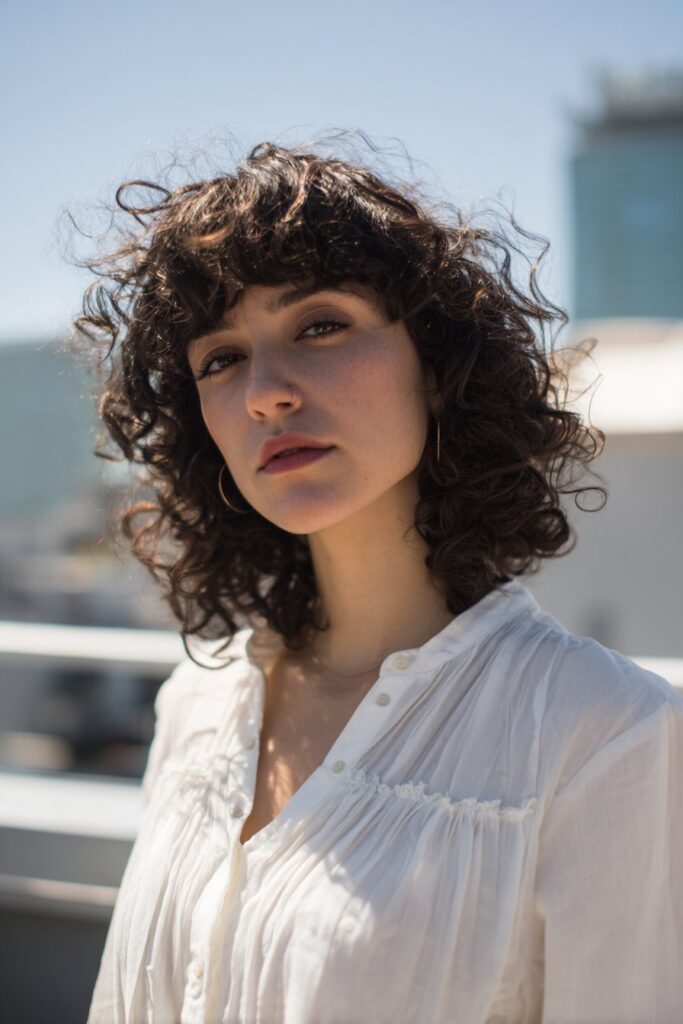 Curly bob hairstyle with textured bangs