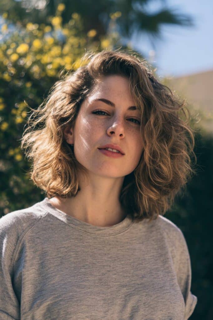 Textured shag hairstyle for women with medium-length hair.