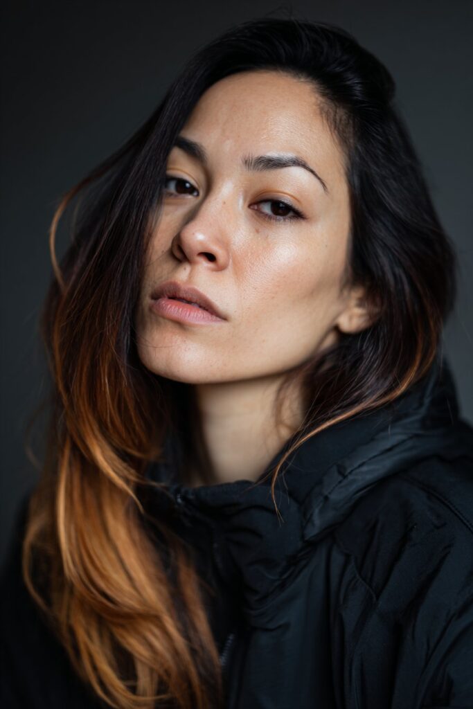 Black-brown ombre hair color creating edgy contrast for hazel eyes