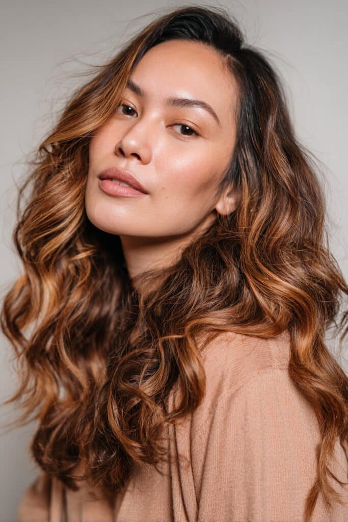 Caramel tiger eye hair with soft face-framing highlights
