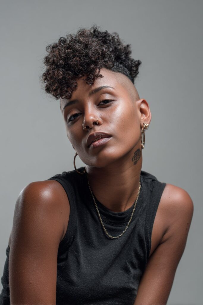 Curly undercut hairstyle for Black women, edgy short haircut