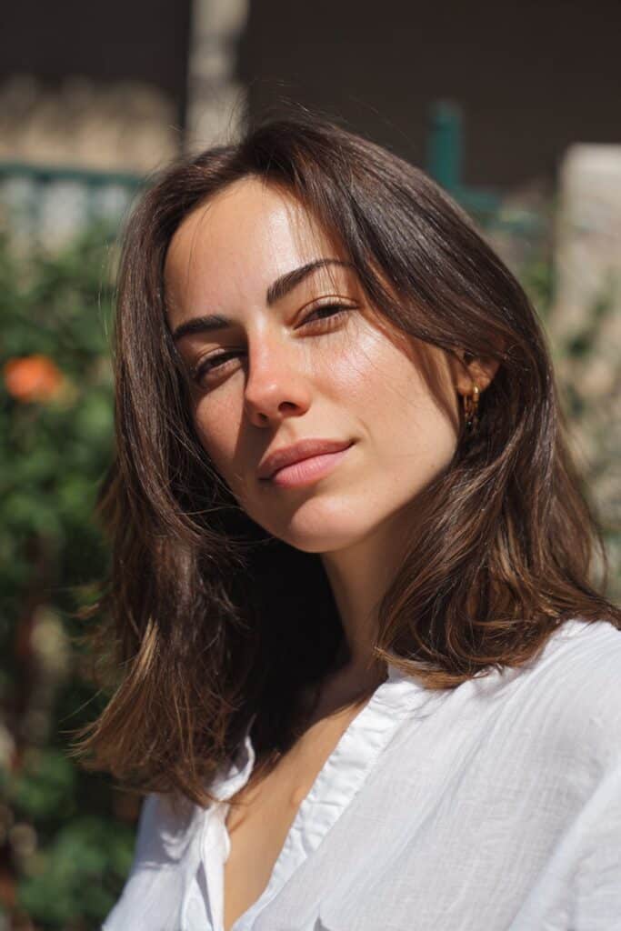 Golden bronde hair color blending brunette and blonde tones